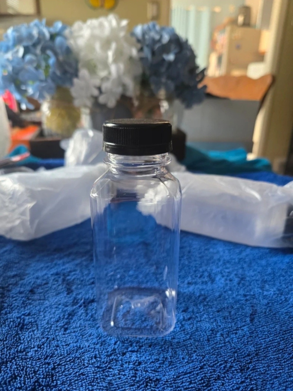 Clear & Black Plastic Storage Bottle